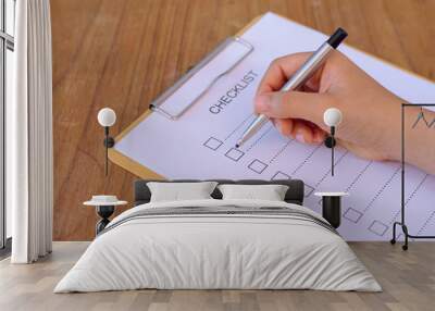 image of businessfemale preparing checklist at office desk Wall mural