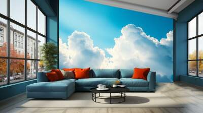 serene sky filled with fluffy white clouds against a bright blue backdrop, creating a peaceful and airy atmosphere. Wall mural