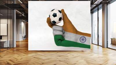 Mini ball of football in India flag painted hand, hold it with two finger on white background. Concept of sport or the game in handle or minor matter. orange white and green with Ashoka Chakra wheel. Wall mural