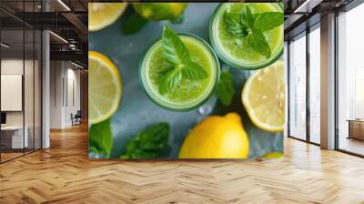 Healthy green smoothie or shake made out of fresh and organic lime and lemon on a kitchen counter top Wall mural