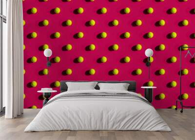 mosaic of tennis balls with strong shadows on a pink background Wall mural