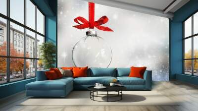 Transparent Christmas ball ornament on snowy background Wall mural