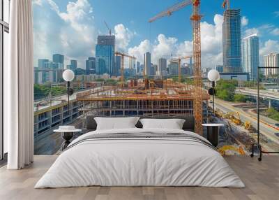 busy construction site with cranes lifting materials and workers Wall mural