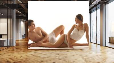 A young and beautiful Caucasian couple in white lingerie Wall mural