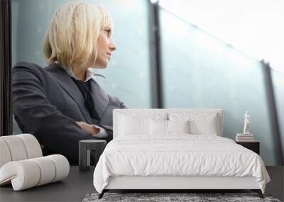 A young blond business woman in formal clothes Wall mural