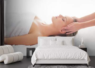 Attractive woman getting spa treatment over white background Wall mural