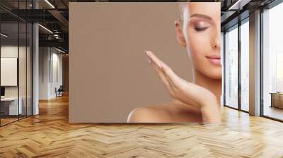 Beautiful face of young and healthy woman. Skin care, cosmetics, makeup, complexion and face lifting. Wall mural