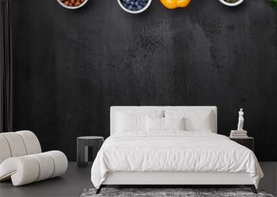 Dieting and healthy eating concept: fruits, vegetables, vegan food ingredients over natural background. Wall mural