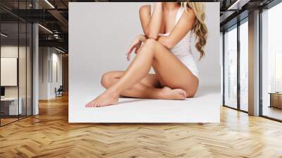 Fit and sporty girl in white underwear. Beautiful and healthy woman posing over isolated white background. Sport, fitness, diet, weight loss and healthcare concept. Wall mural