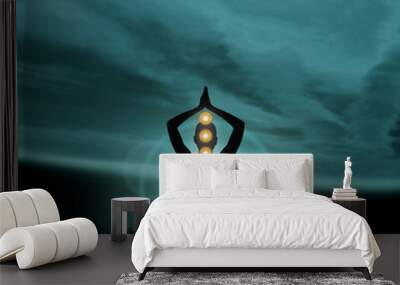 Silhouette of a monk meditating in a lotus position Wall mural