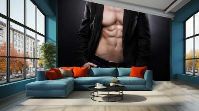 Strong, fit and sporty stripper man over black background Wall mural