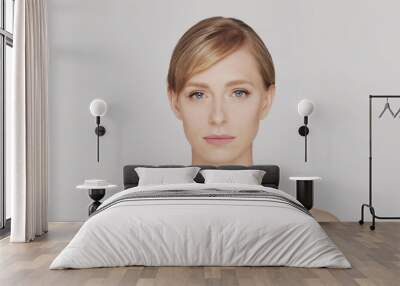 Studio portrait of young, beautiful and natural blond woman. Wall mural