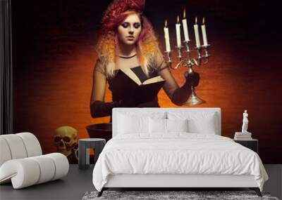 Witch making witchcraft in the dungeon. Halloween concept. Wall mural