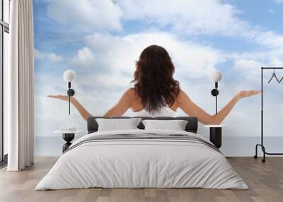 Young fit brunette meditating Wall mural