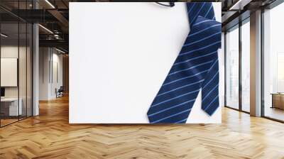 Father's Day concept. Top view vertical photo of blue tie cufflinks glasses and cup of coffee on isolated white background with empty space Wall mural