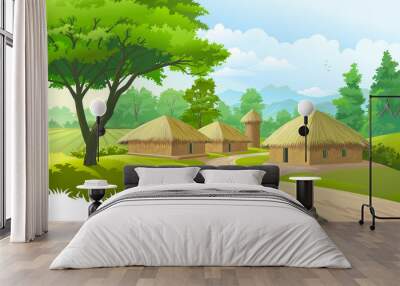 A beautiful village with farmlands, trees, meadows and with mountains in the background Wall mural