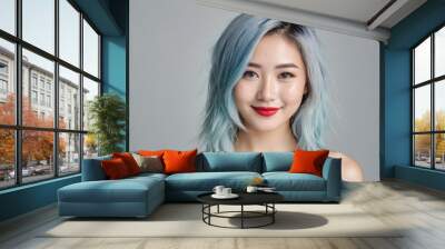 Beautiful smiling asian woman with blue hair, and red lips wearing black tank top on gray background Wall mural