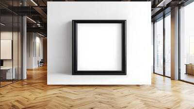 Blank photo frame on white wall. Empty black frame with empty copy space. Isolated blank frame on wall for mockup. Wall mural