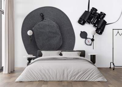 Hat, binoculars, and compass isolated in a flat layout design on a pure white background Wall mural