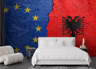 European Union and Albany - Cracked concrete wall painted with a EU flag on the left and a Albanian flag on the right stock photo Wall mural