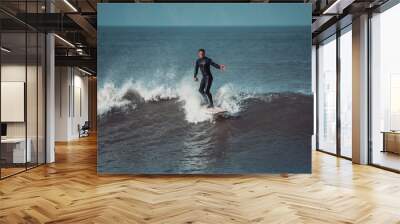 Surfer on a wave in Devon Wall mural