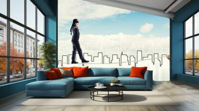 Business concept of risk support and assistance with man balancing on rope Wall mural