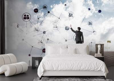 Businessman on house roof presenting networking and connection c Wall mural