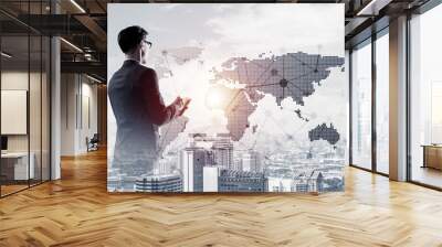 Concept of business success and control with confident boss against cityscape background Wall mural