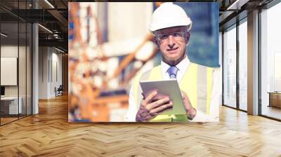 Construction manager controlling building site and tablet device Wall mural