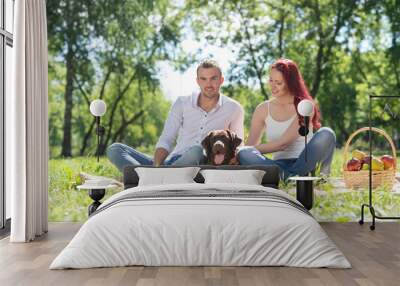 Couple with a dog in the park Wall mural