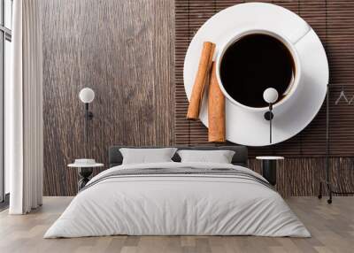 Cup of black coffee on wooden table Wall mural