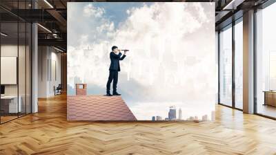 Engineer man standing on roof and looking in spyglass. Mixed med Wall mural