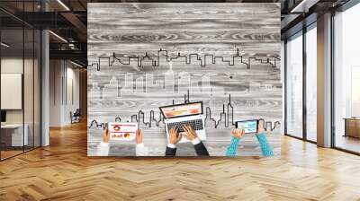 Top view of businesspeople sitting at table and using gadgets Wall mural