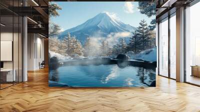 A steaming hot spring nestled in a snowy forest with a snow-capped mountain in the background Wall mural