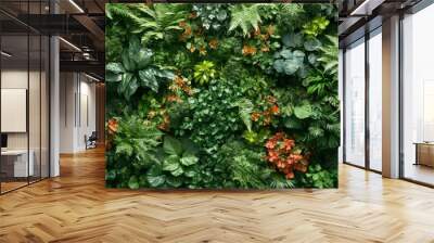 Lush Green Wall with Orange Flowers and Various Leaf Shapes Wall mural