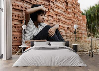 Child working in a brick factory. world day against child labor concept Wall mural