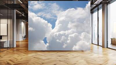 Clouds background. Blue sky with fluffy white clouds. Sunny day with beautiful weather. Wall mural