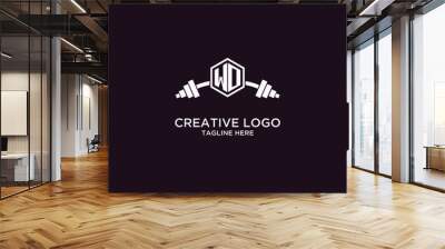 WO initial monogram for fitnes or gym logo with creative shield and barbell design Wall mural