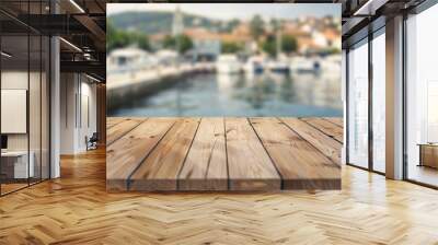 wooden tabletop with a blurred background of a harbor with boats and water, Perfect for product displays or presentations Wall mural