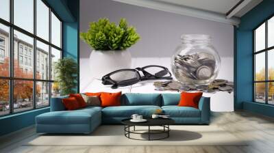 saving concept - coin in glass jar Wall mural