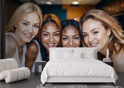 A diverse group of women are smiling at the camera. Wall mural