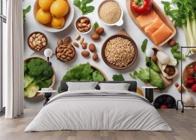 A set of healthy food. Fish, nuts, protein, berries, vegetables and fruits. On a white background Wall mural