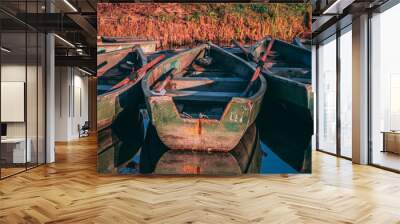 Tiny boats on a lake during autumn Wall mural