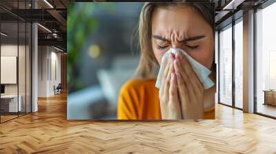 Tissue, nose and sick woman sneezing in living room with allergy, cold or flu in her home Wall mural