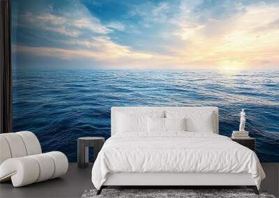 Tranquil seascape with a blue sky and gentle waves. Wall mural