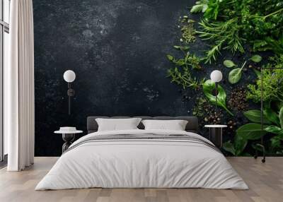 Fresh green herbs on a dark background create a vibrant, natural composition. Wall mural