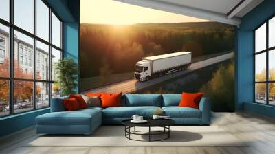 White truck driving on highway winding through forested landscape, sunset light Wall mural