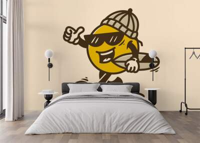 Yellow ball character wearing beanie and holding a surfing board Wall mural