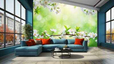 Delicate white blossoms adorn a lush green spring border, softly focusing on a serene natural backdrop with ample copy space for seasonal designs and messages. Wall mural