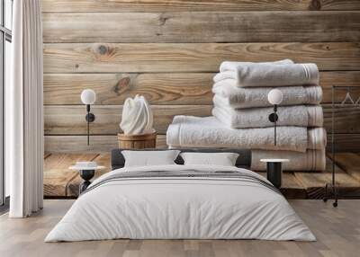 Freshly laundered white towels artfully arranged on a rustic wooden table in a serene bathroom setting, providing ample copyspace for adding text or design elements. Wall mural